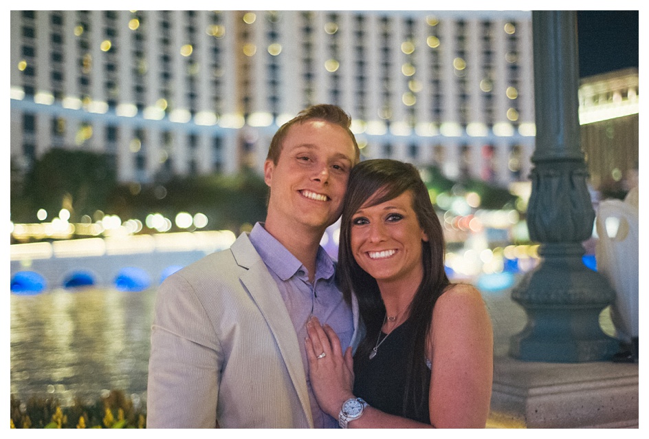 Newly engaged couple poses in front of the bellagio in las vegas nevada engagement portrait