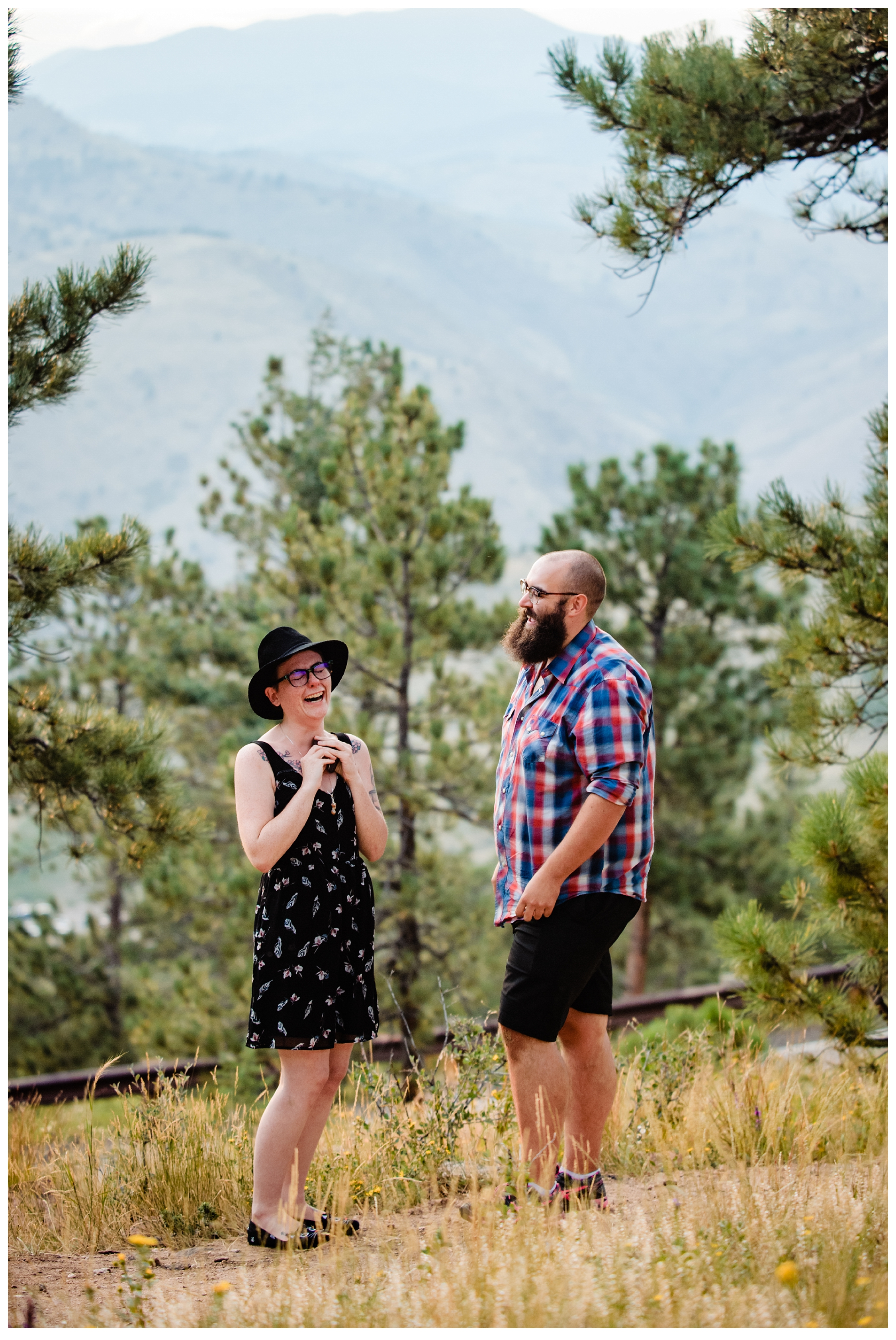 man proposing to his girlfriend on one knee in the mountains engagement story
